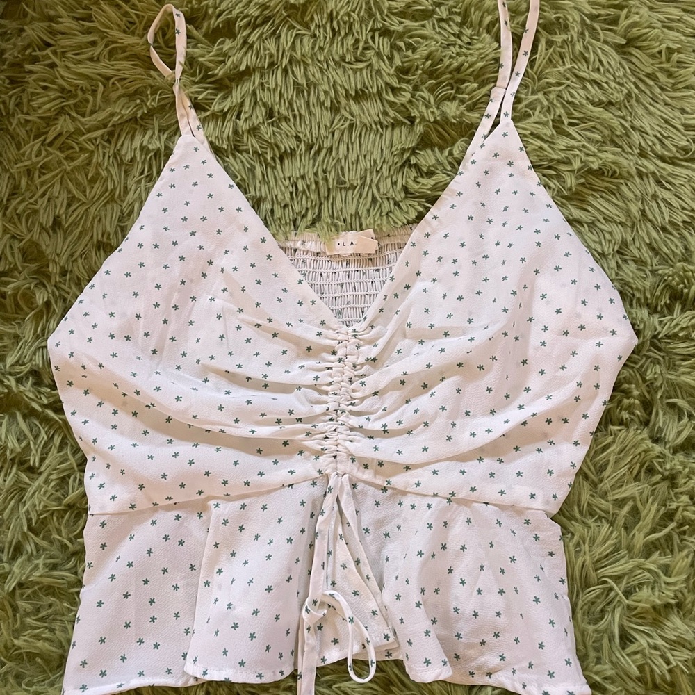 White flowery cinched loose tank top with flower detail